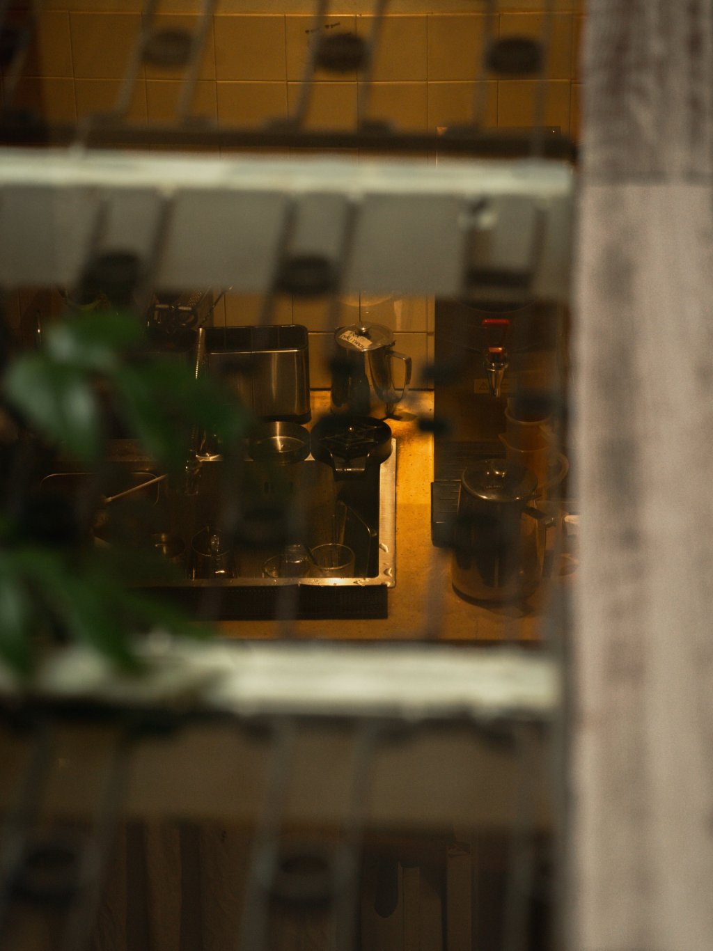 Blurred view of coffee equipment and interior space in Ho Chi Minh City.