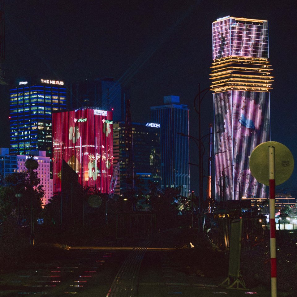 Night view of illuminated buildings in Ho Chi Minh City.
