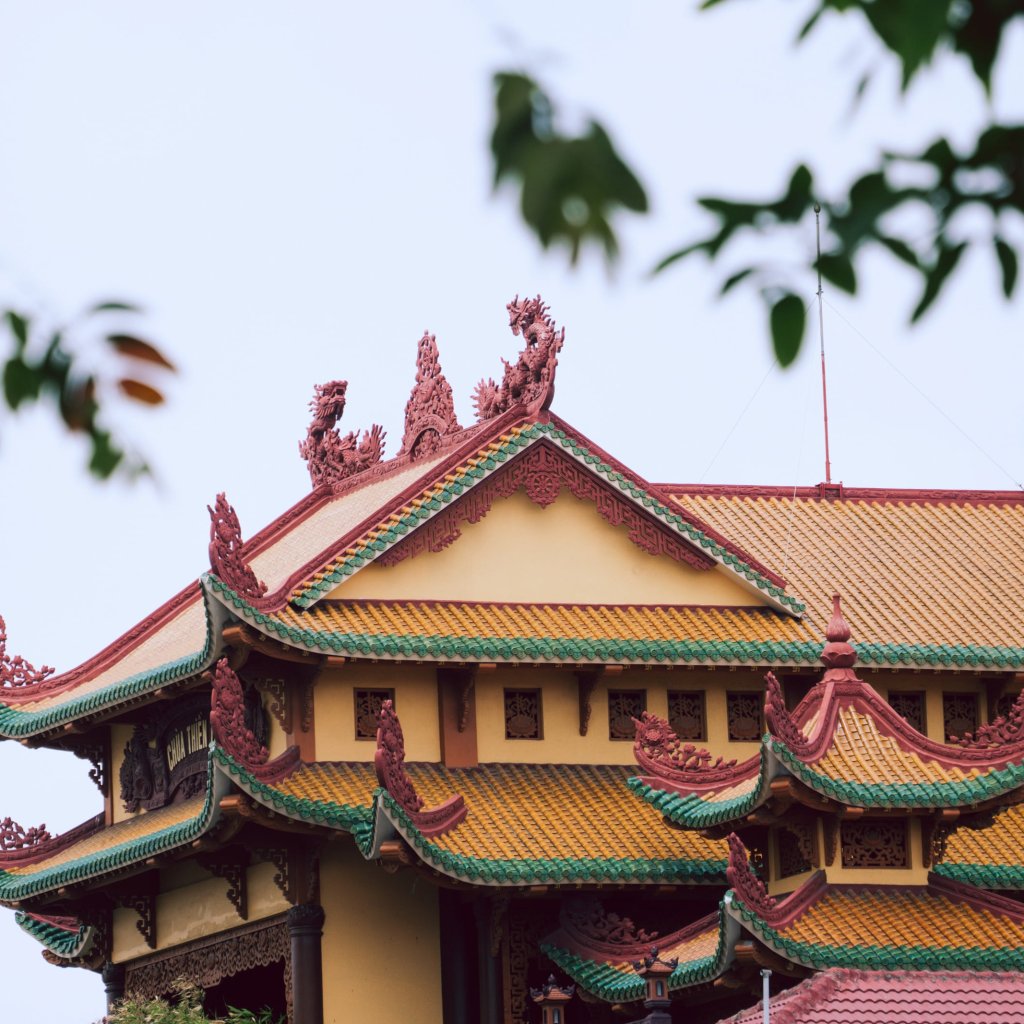 Traditional architecture with ornate, tiled roofs and decorative eaves.