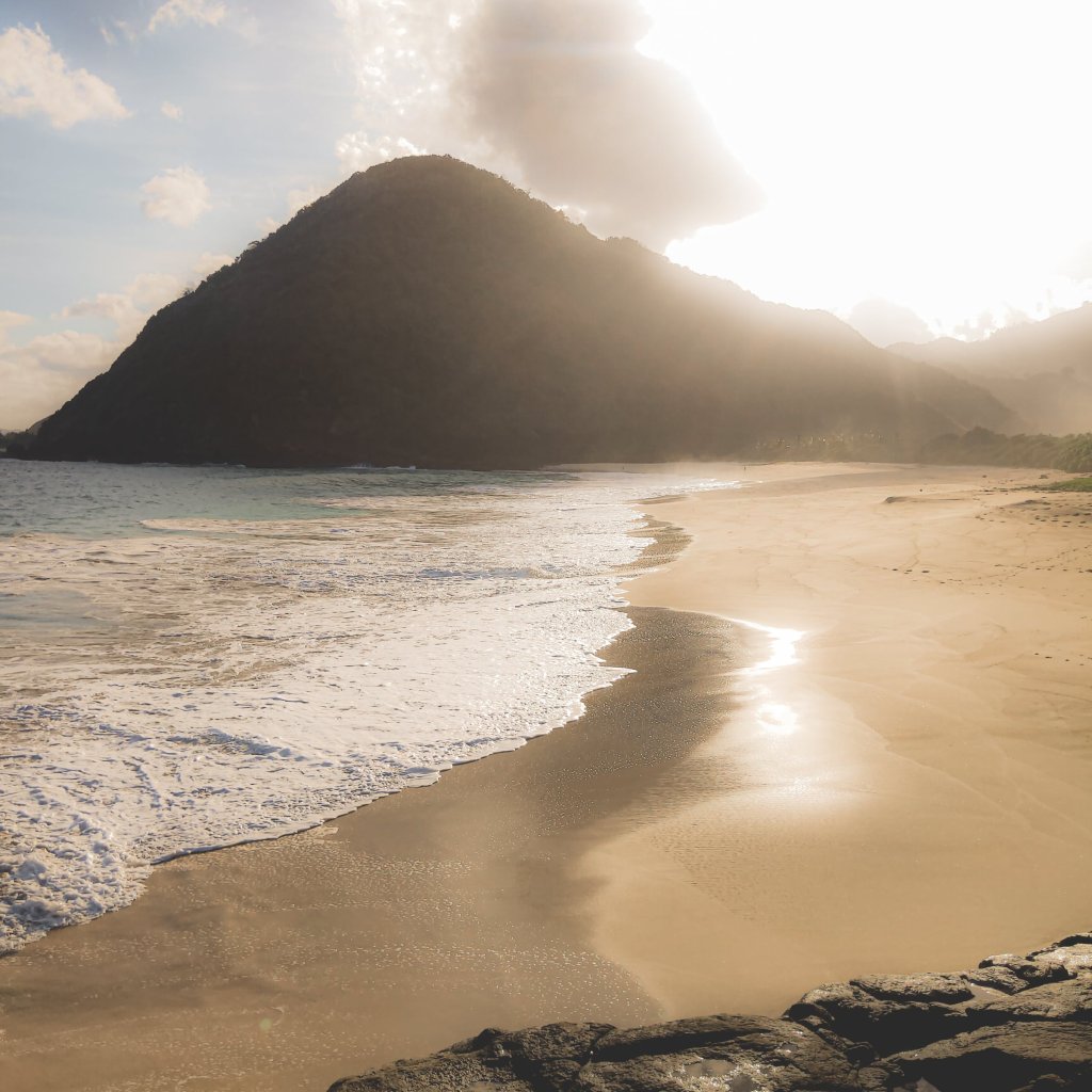 Selong Belanak Beach in South Lombok with calm water and open sand.
