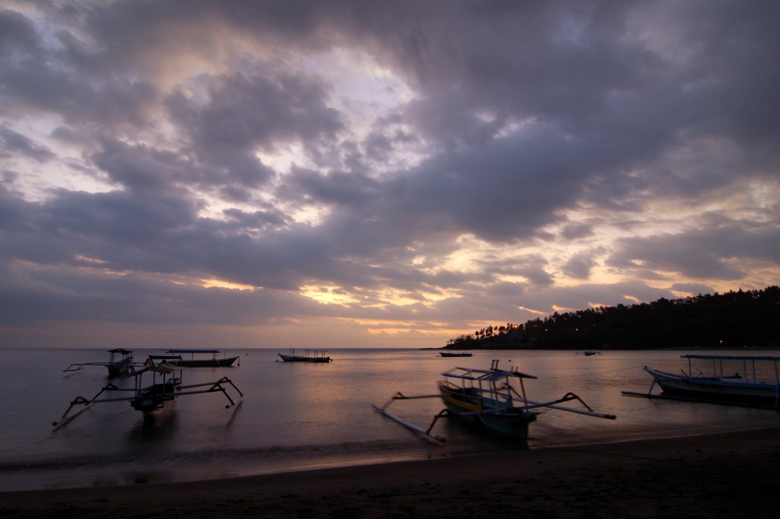 Sunset over the water at Senggigi Beach in West Lombok.