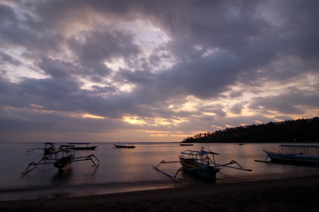 Sunset over the water at Senggigi Beach in West Lombok.