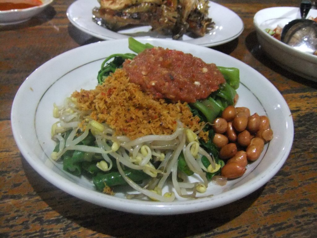 Plecing kangkung with blanched water spinach, sambal, bean sprouts and peanuts.
